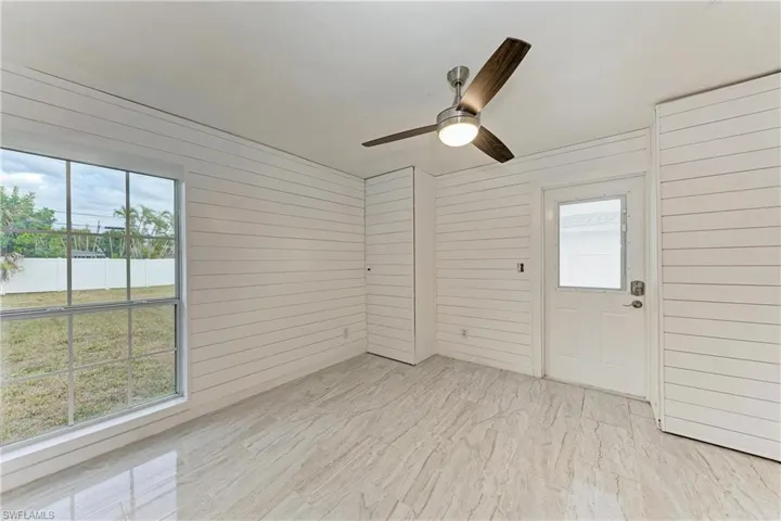 Unfurnished sunroom featuring plenty of natural light
