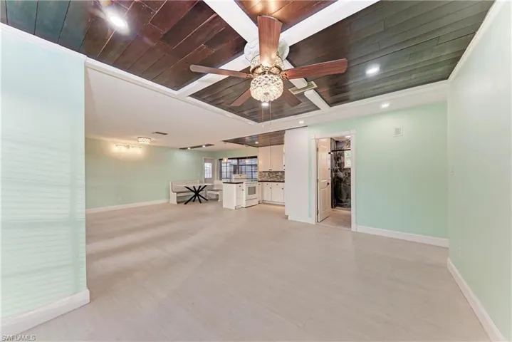 Unfurnished living room with wood ceiling, light wood finished floors, recessed lighting, and a ceiling fan