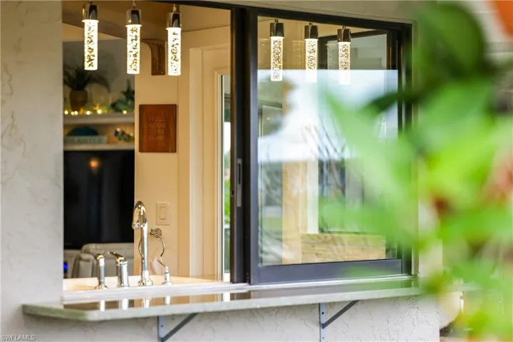 pass through window in kitchen leads to patio