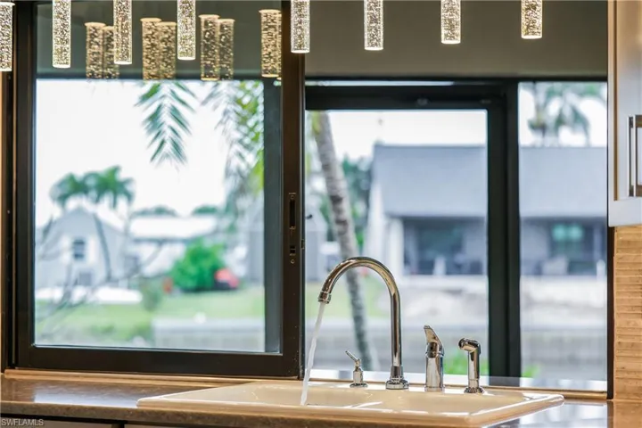 Room details featuring sink overlooking the water