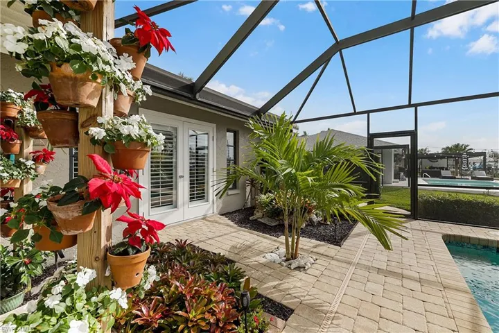View of patio with french doors and a lanai