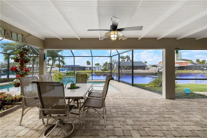 Patio featuring a pool and water view