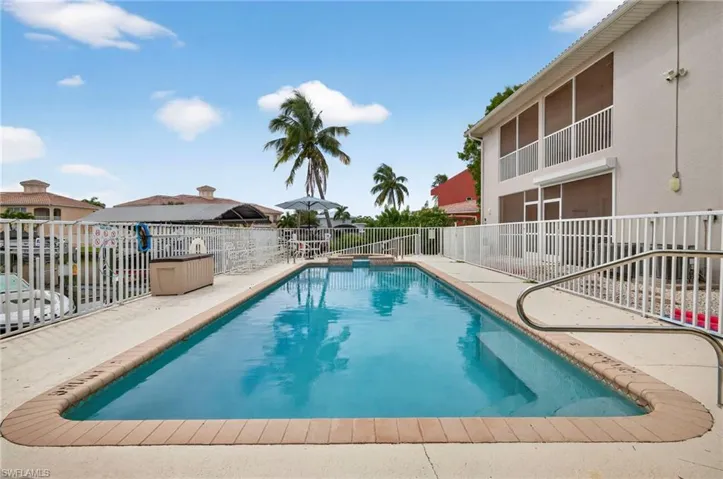 View of pool featuring a patio area and a pool with connected hot tub