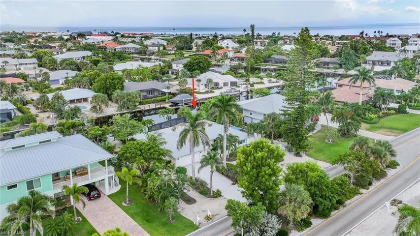 Aerial view of residential area with a large body of water