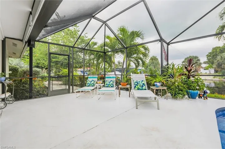 View of patio / terrace with a lanai, a sunroom, and an outdoor pool