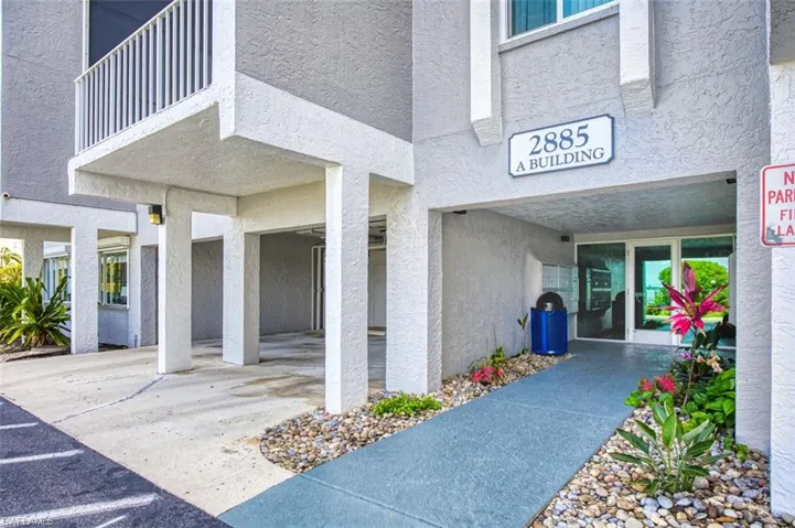 Property entrance featuring stucco siding