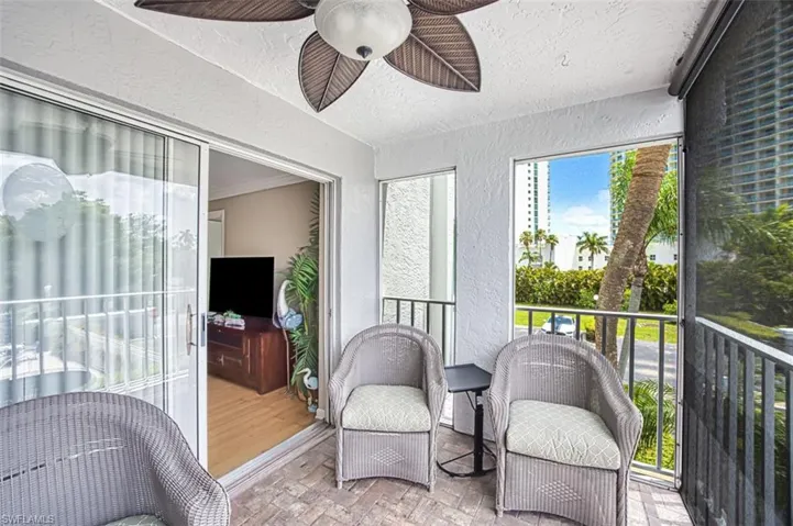 Sunroom featuring ceiling fan