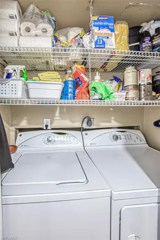 Laundry room featuring separate washer and dryer