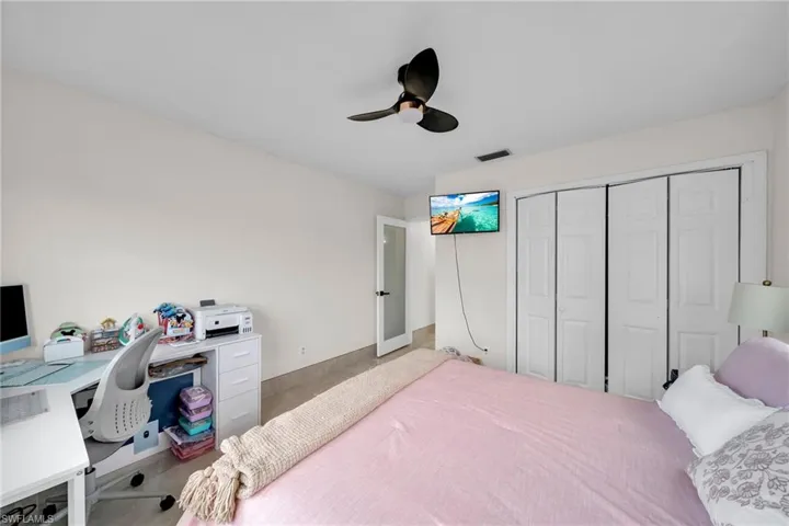Bedroom featuring a closet and ceiling fan