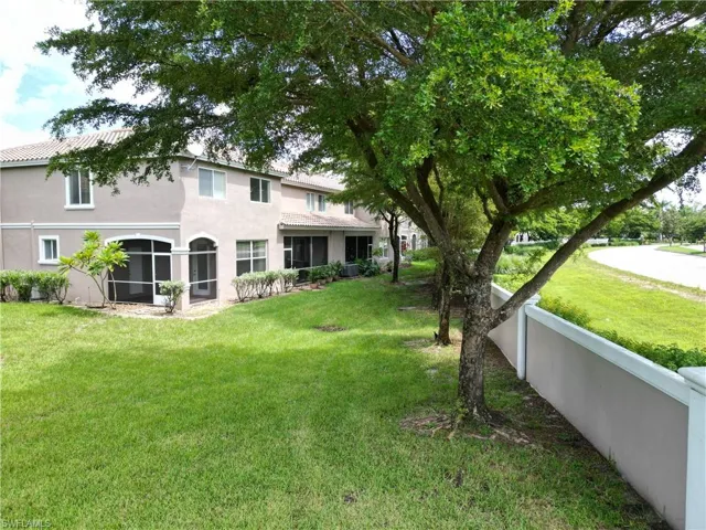 View of yard featuring a sunroom