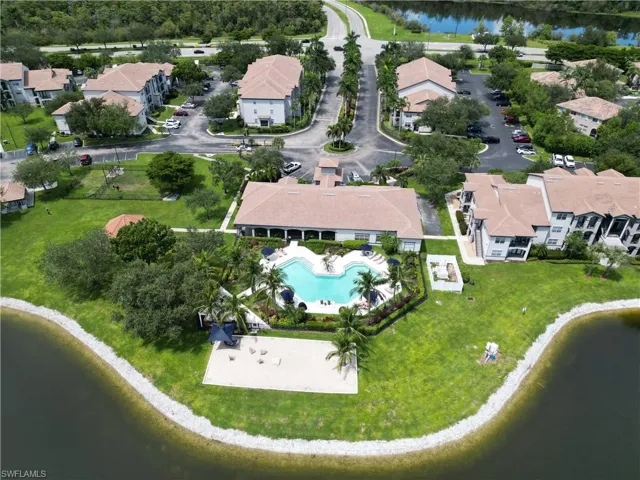 View of property location featuring a nearby body of water and nearby suburban area