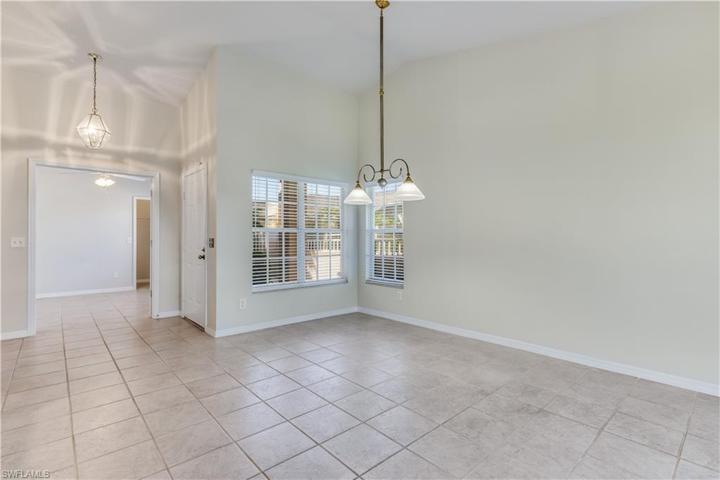 Front Entry and Dining Area, Den/Guest Bedroom in Background