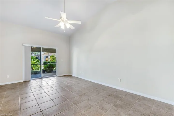 Master Bedroom With Vaulted Ceiling and Slider to Lanai