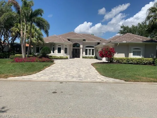 Mediterranean / spanish-style home featuring a front lawn