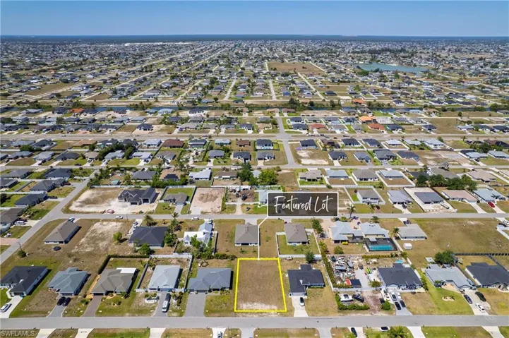 Aerial view of property's location featuring nearby suburban area
