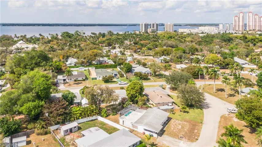Aerial perspective of suburban area with a nearby body of water