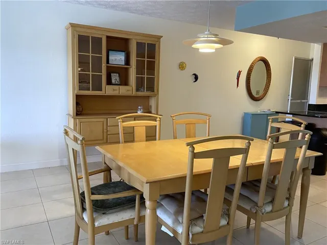 Light and bright dining area with tile floors