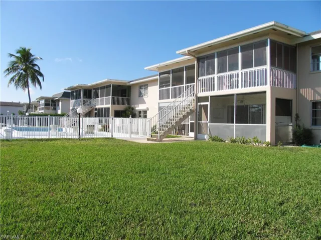 View of the back of the community, pool and greenspace
