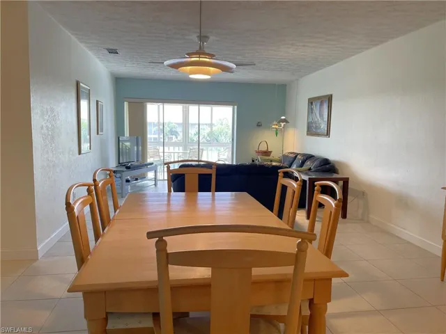 Light and bright dining area with tile floors
