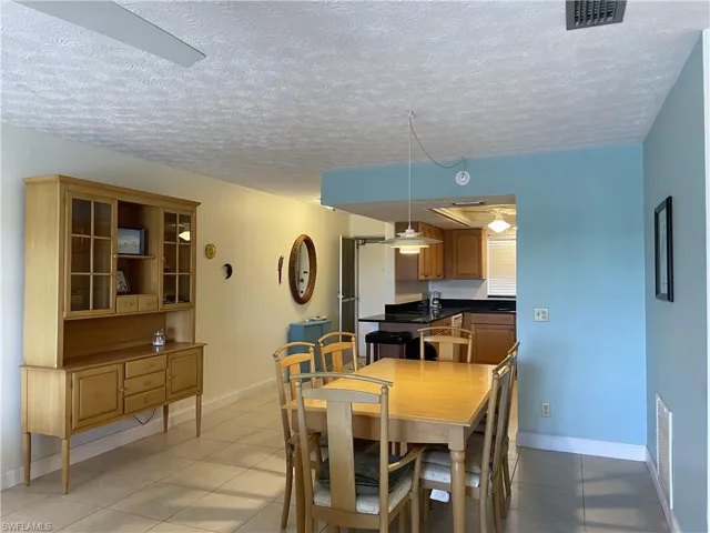 Light and bright dining area with tile floors