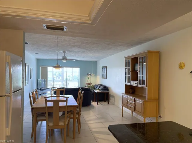 DLight and bright dining area with tile floors