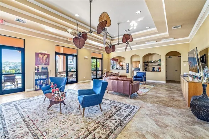 Common area with crown molding and recessed lighting