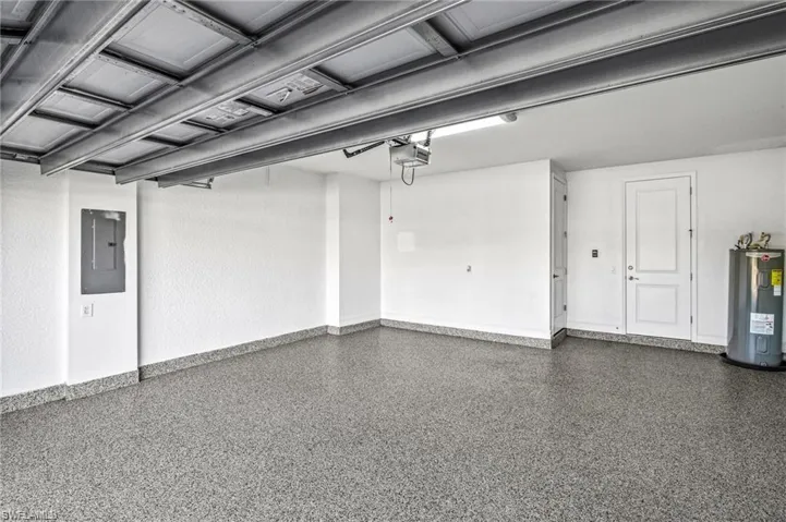 Garage with electric panel and electric water heater