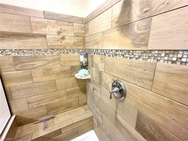 Bathroom featuring walk in shower