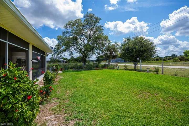 View of yard with a sunroom