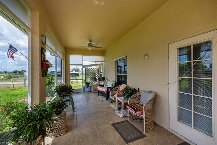 Sunroom / solarium featuring ceiling fan