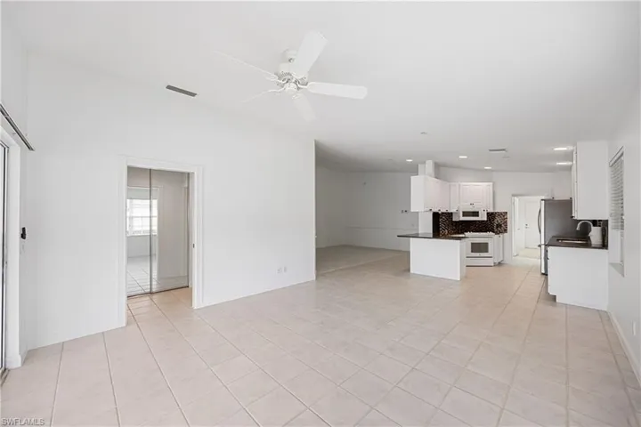 Open Den Looking towards Kitchen, Great Room and Hall Closet
