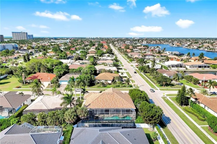 Aerial view of residential area with a nearby body of water