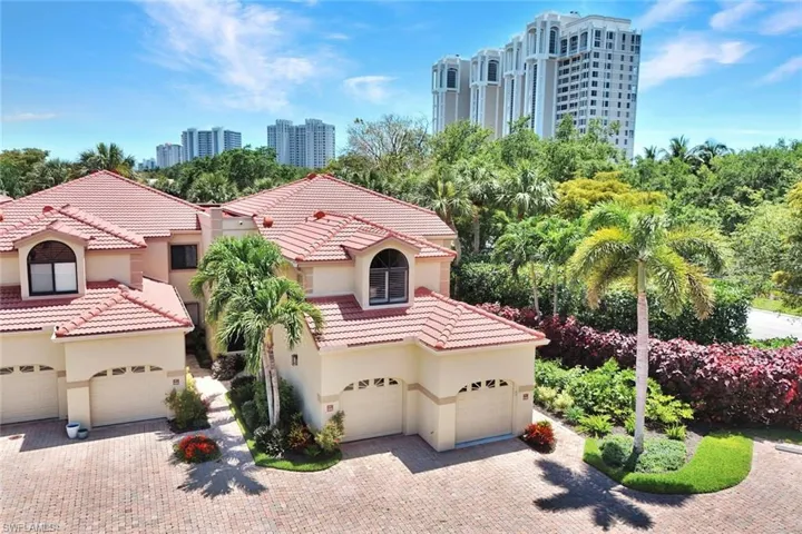 Mediterranean-style townhomes featuring barrel tile roofs and stucco exteriors
