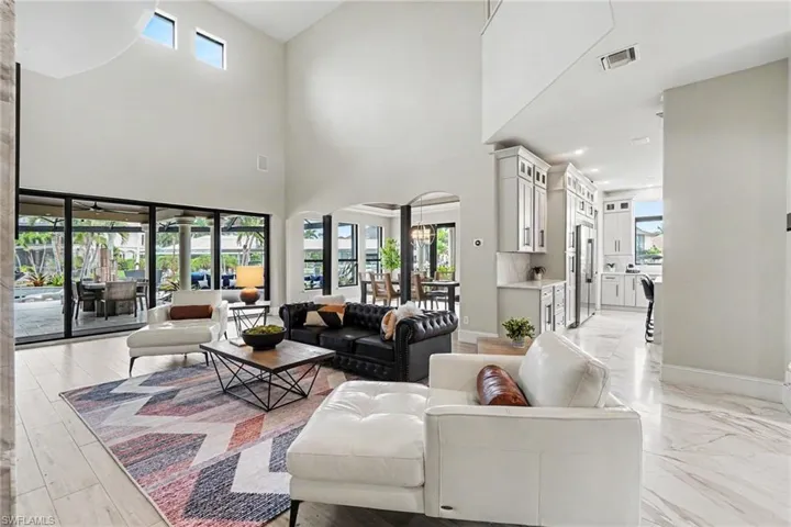 Expansive living area with soaring ceilings and large-format sliding glass doors