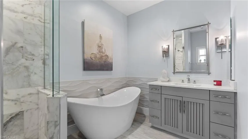 Guest bathroom #1 with Freestanding soaking tub and frameless glass walk-in shower!