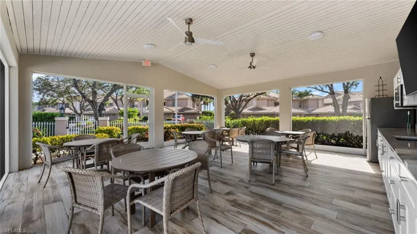 Waterford covered pool are with refrigerator, microwave, sink, storage, and TV!