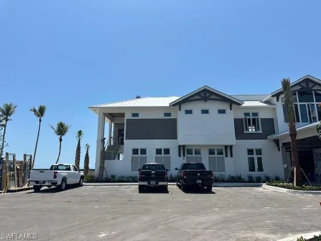 Front view of new Beach Club directly on the beach with Gulf Views and toes in the sand. You can drive here or take the trolley.