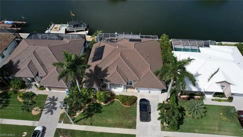 View from above of property with a nearby body of water