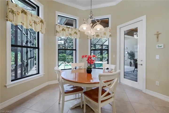 Casual Dining with Tall Bay Windows and French Door to Lanai