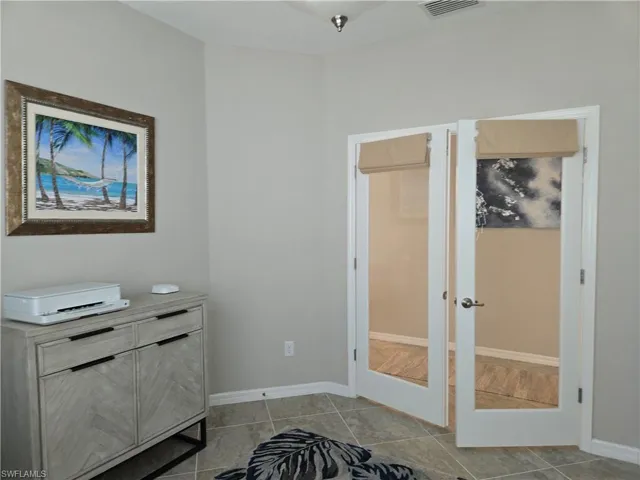 Den with pull-down shades on doors