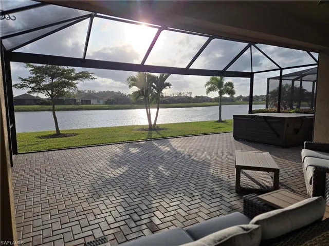 Beautiful view, extended lanai with pavers, picture-frame screening and hot tub!