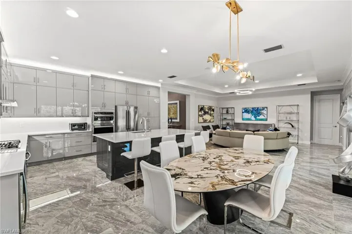 Notice the extended upper cabinetry and glass doors.