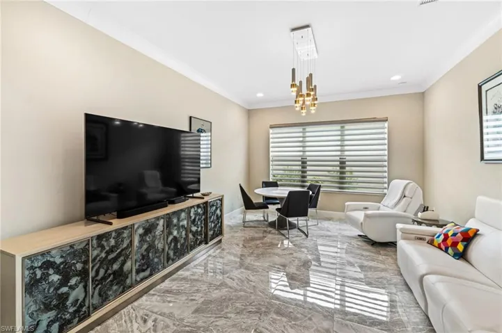 The spacious den offers flexibility for a home office, media or hobby space