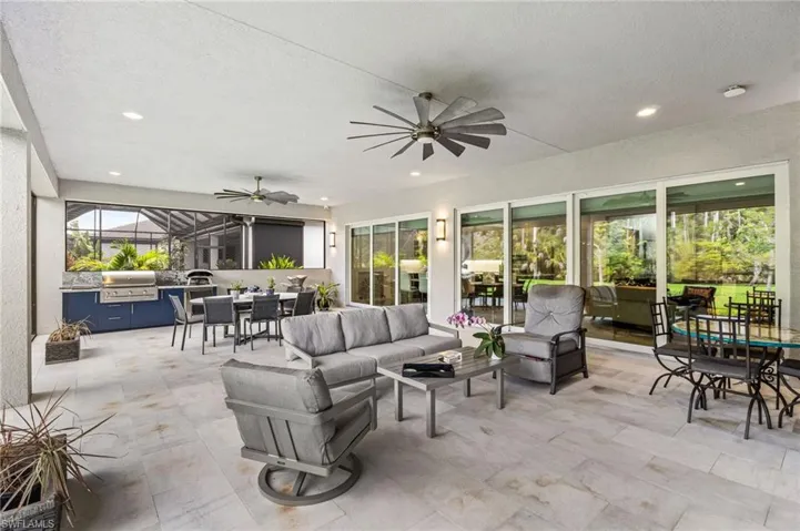 Complete with a summer kitchen with natural gas grill, and a stunning fireplace feature wall, this space is designed for year-round enjoyment while overlooking peaceful preserve scenery and an expansive backyard rarely available in community living.