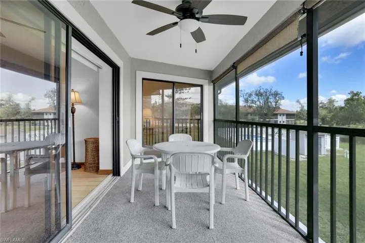 Sunroom / solarium with a ceiling fan