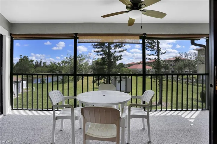 Sunroom featuring ceiling fan