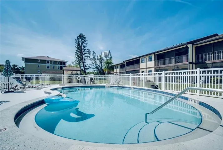 Community pool featuring a patio