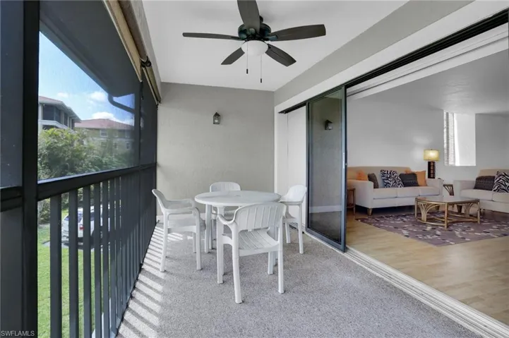 Balcony with a ceiling fan, outdoor dining space, and an outdoor hangout area