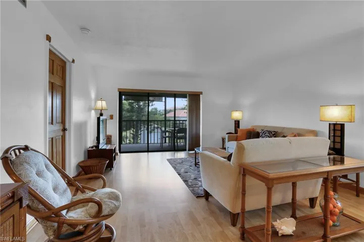 Living room with light wood-style flooring