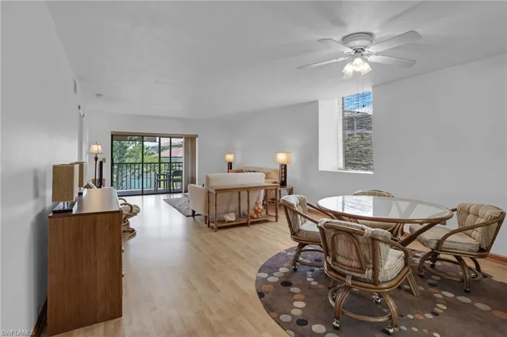 Dining space with light wood-type flooring and a ceiling fan